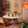 Roomset of pyschedelic check wallpaper in retro tones