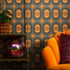 Roomset close-up of Hornsea pattern wallpaper in earthy orange, pine and chocolate colourway