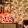 Roomset close-up of interwining Josephine plant wallpaper in vintage browns and orange colourway
