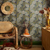 Roomset of matisse pattern wallpaper in walnut and wasabi green on teal colourway