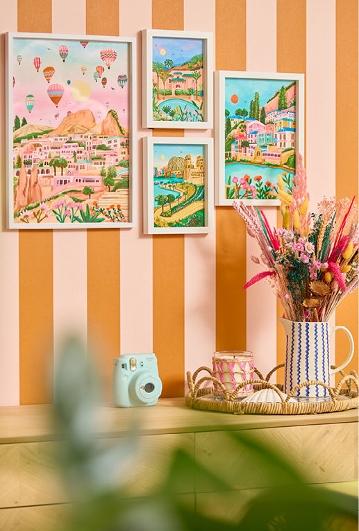 Roomset close-up of striped wallpaper in pink and orange